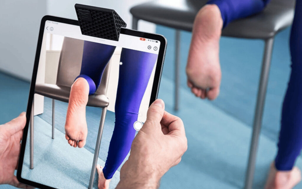 Podiatrist, Nilofar Malikyar, treating a patient in Adelaide for sports-related foot injuries.